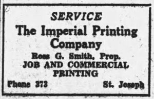 A white sign in black lettering that says, "Service. The Imperial Printing Company. Ross G Smith, Prop. Job and Commercial Printing. Phone 373 St. Joseph" 