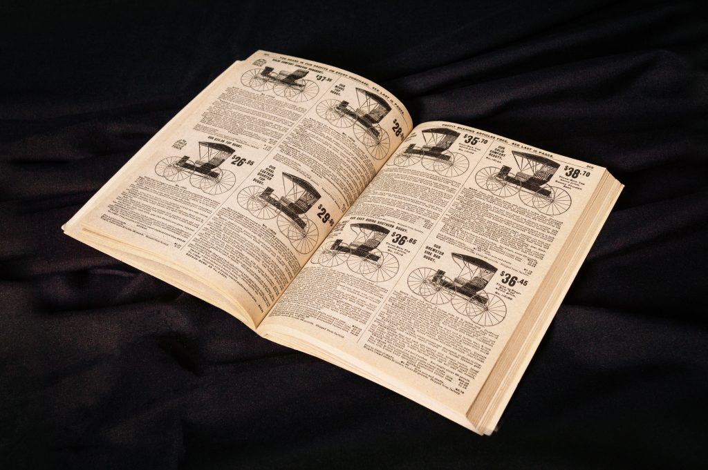 A spread of an old Sears catalog with a black background.