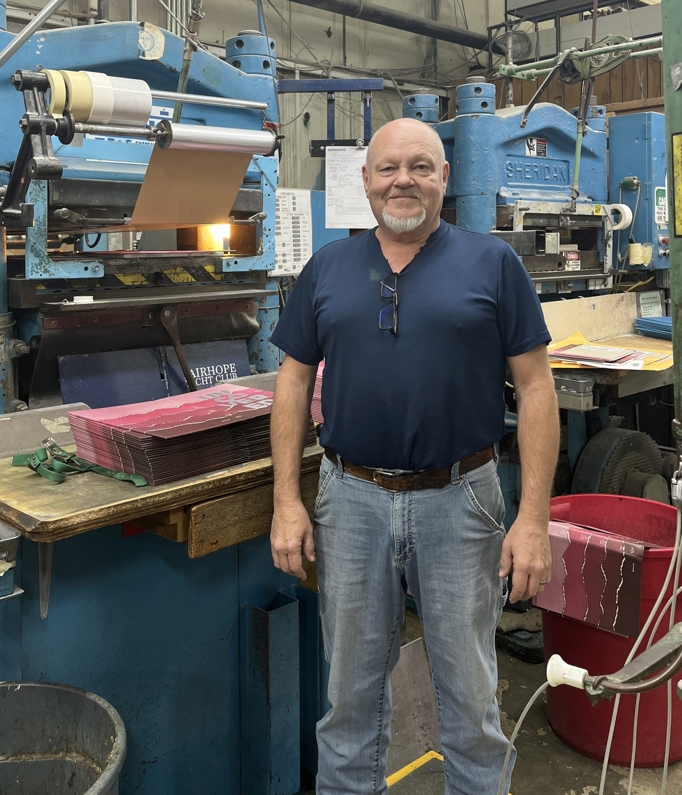 Darryl Niemeier standing in front of finishing machinery