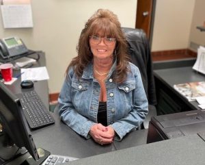 Renita Terry smiling at her desk