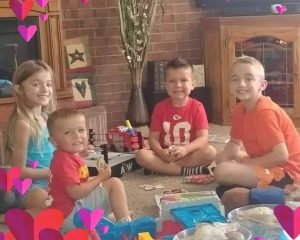 Renita Terry's four grandchildren playing Uno