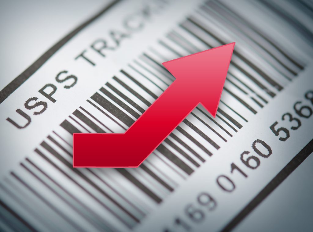 An illustration of a bar code that is labeled "USPS Tracking" with a red arrow pointing upward