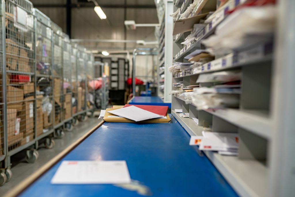 A blue mailing assembly line