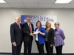 Don O. Walsworth and Jeff Vogel present a $2,500 check to Kensie Daleske, Melinda Wilbeck and Denise Carlson from Brookfield R-III School District.
