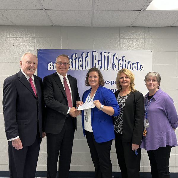 Don O. Walsworth and Jeff Vogel present a $2,500 check to Kensie Daleske, Melinda Wilbeck and Denise Carlson from Brookfield R-III School District.