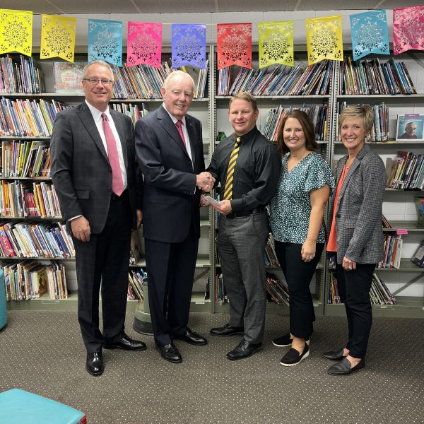 Don O. Walsworth and Jeff Vogel present a $2,500 check to Dr. Zach Bruner, Amy Sportsman and Sarah Dunham from Marceline R-V School District.