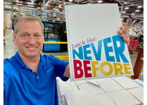 Jeff Bell with a yearbook