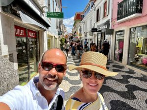 Kirsten with her boyfriend Marco on their trip in Portugal in front of some local shops