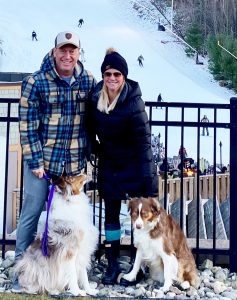 Jeff Bell with his wife and two austrailian shepards