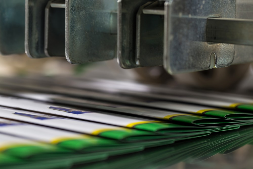 Many signatures traveling through a printing press