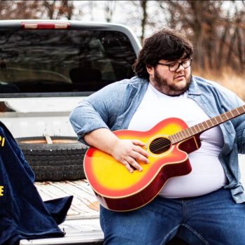 Evan Burgener with guitar