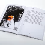 A magazine spread with a goose graphic and text