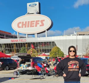 Sara standing in front of arrow head stadium, home of the chiefs