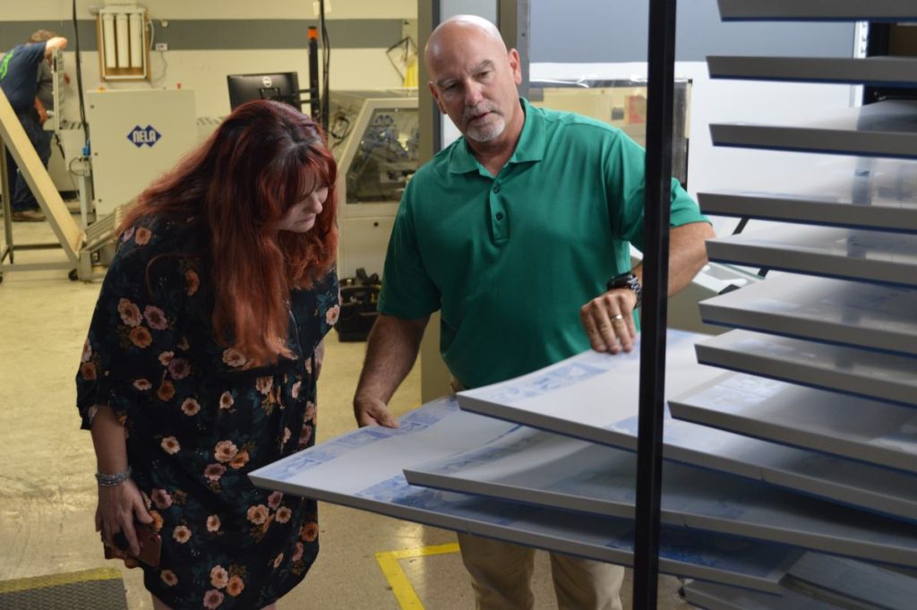 Susan W. and Kevin W. examining plates