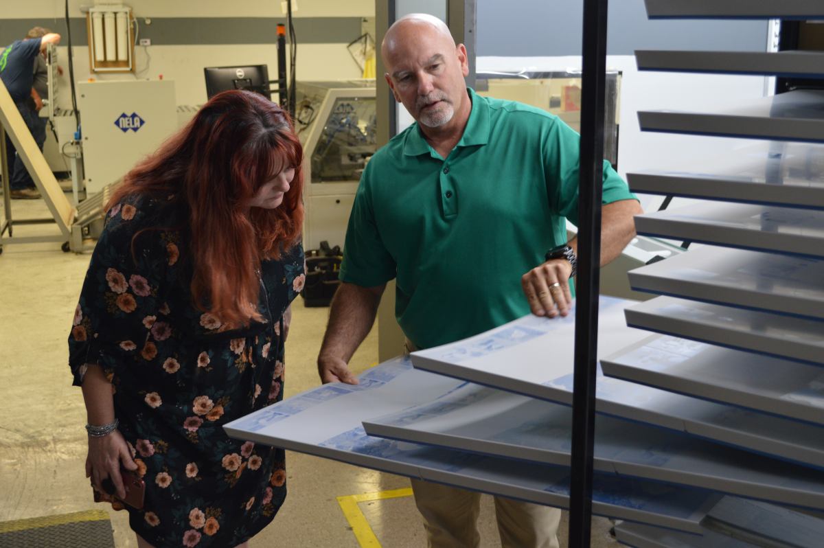 Susan W. and Kevin W. examining plates