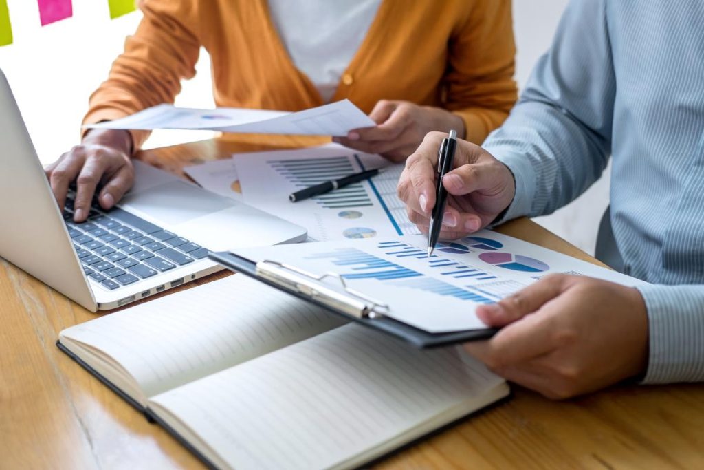 Marketing professionals collaborating with a presentation