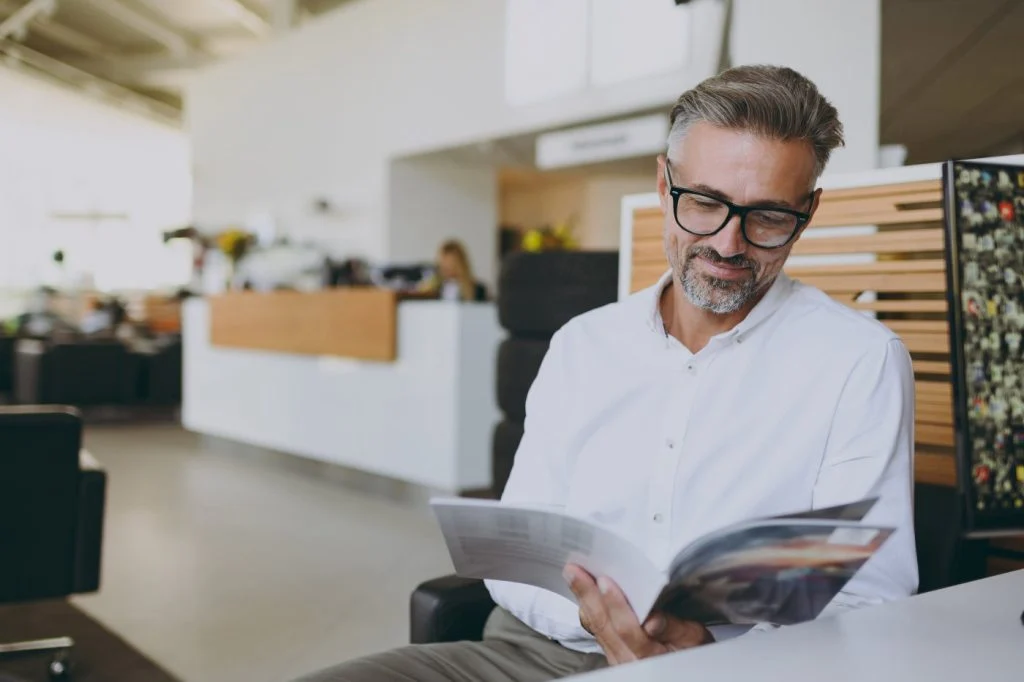 A business man reading a catalog