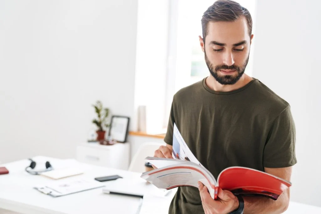 Man reading a catalog