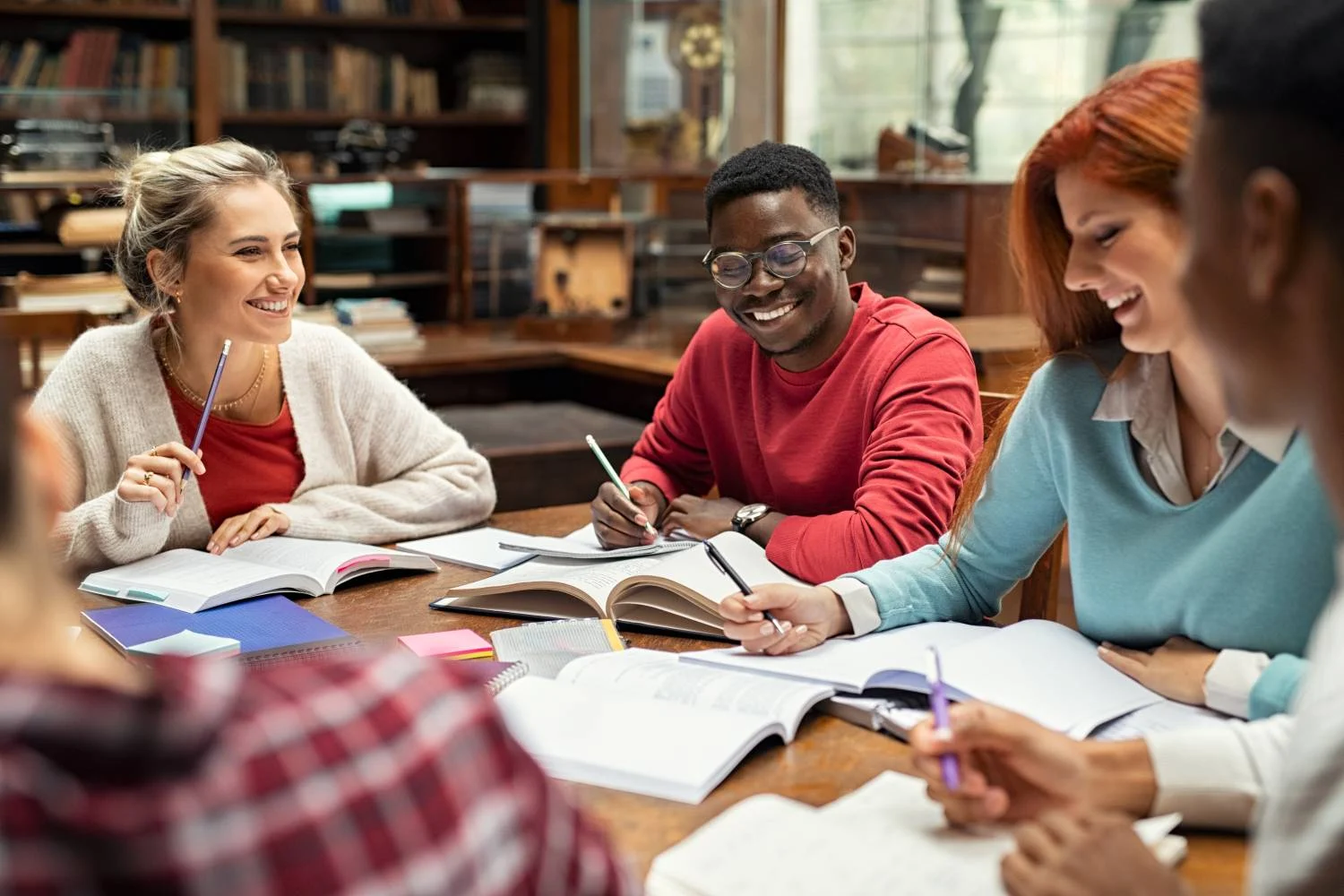 College students studying around a table