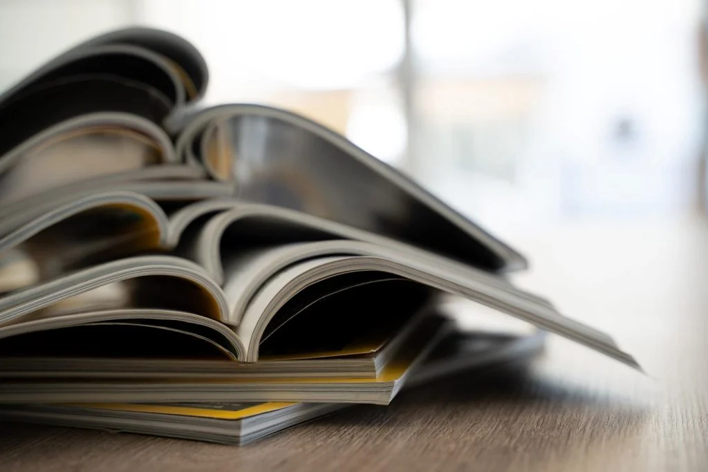 A stack of open catalogs