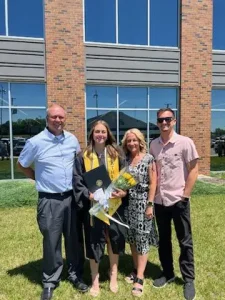 Charlie and his family at his daughter's graduation.