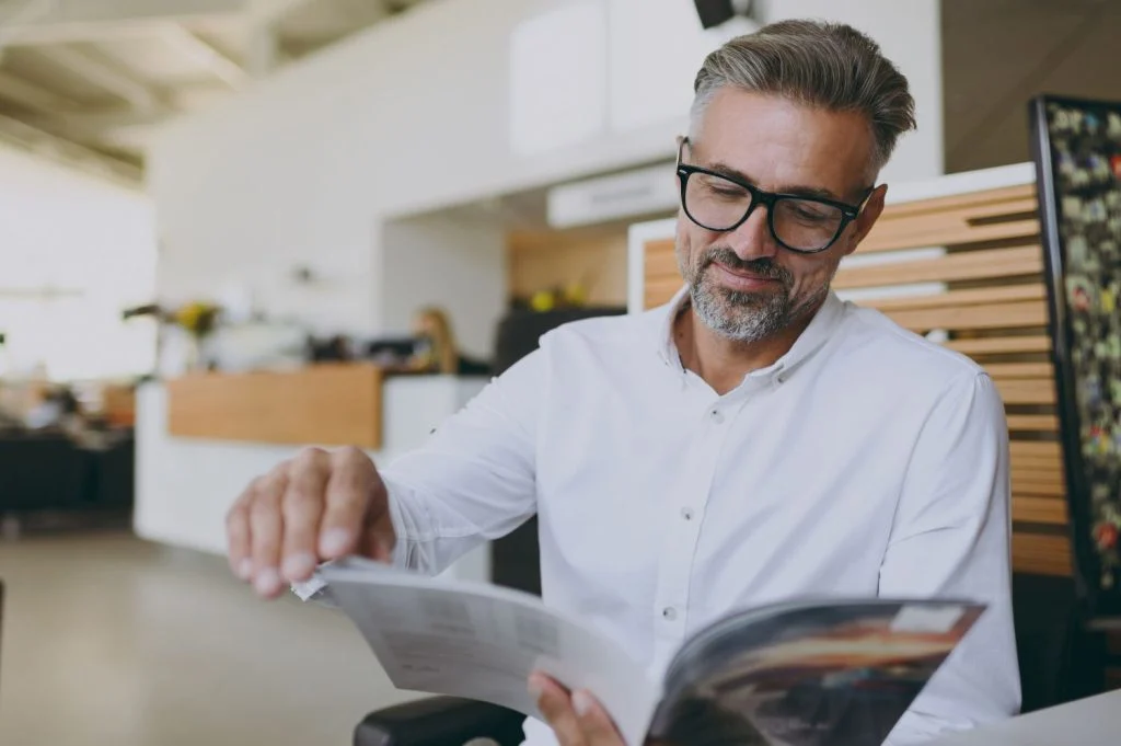A businessman reading a magazine