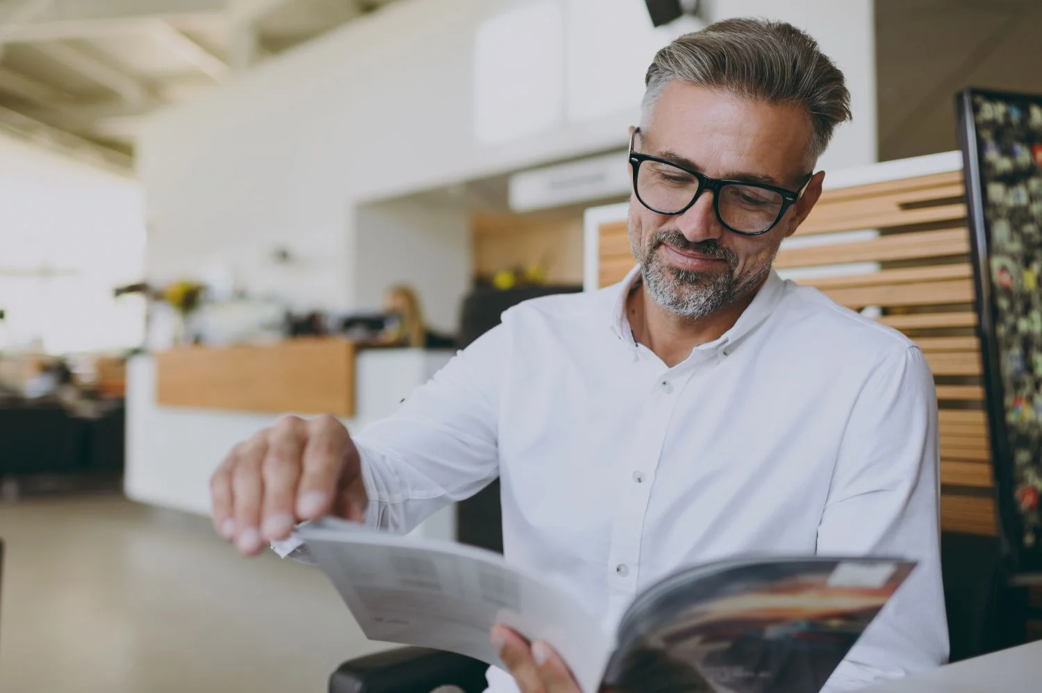 A businessman reading a magazine